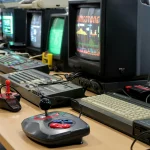 old computer and consoles with retro joysticks