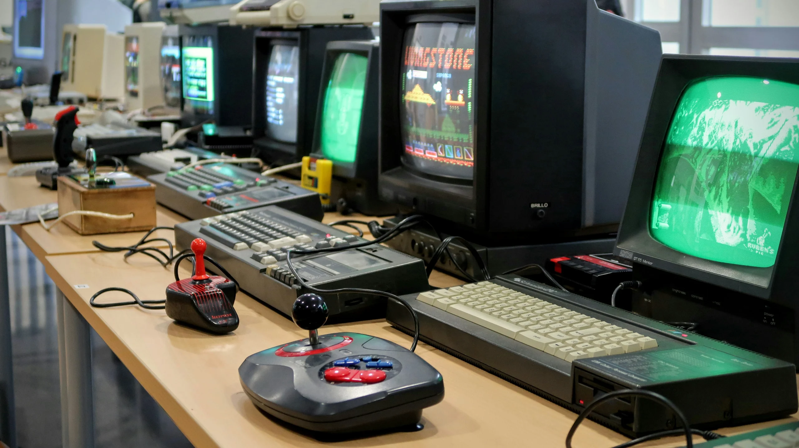 old computer and consoles with retro joysticks